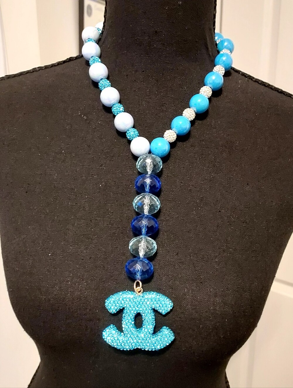 Handmade Blue Crystal Bead Necklace with Turquoise Logo Pendant